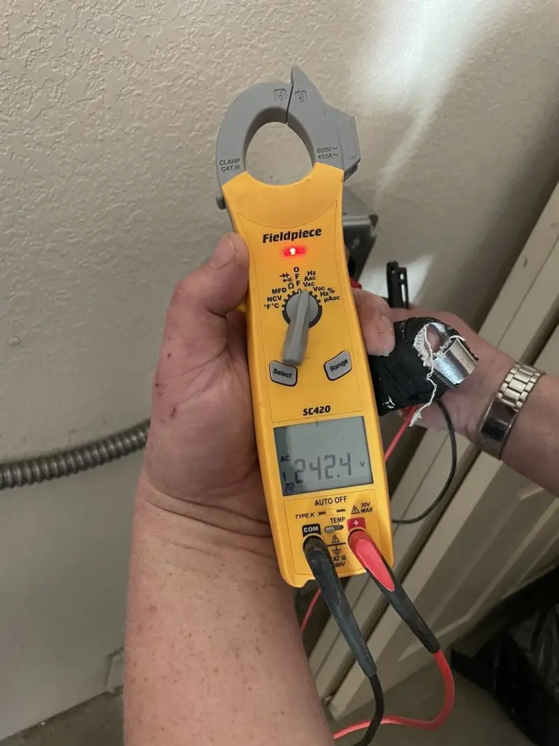Voltage testing with clamp meter during Ceiling Fan Installation in Great Falls
